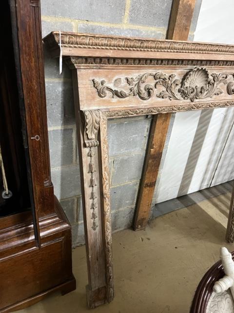 A Georgian carved pine fire surround, width 143cm, height 135cm (aperture width 96cm, height 105cm)